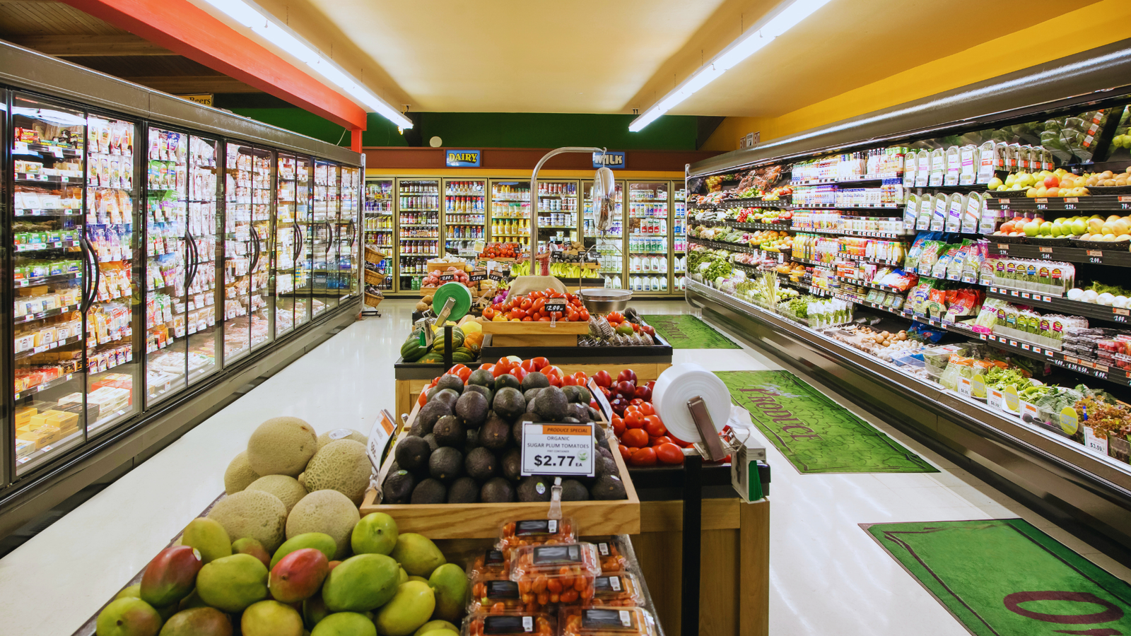 Organized grocery store racks and modern retail fixtures.