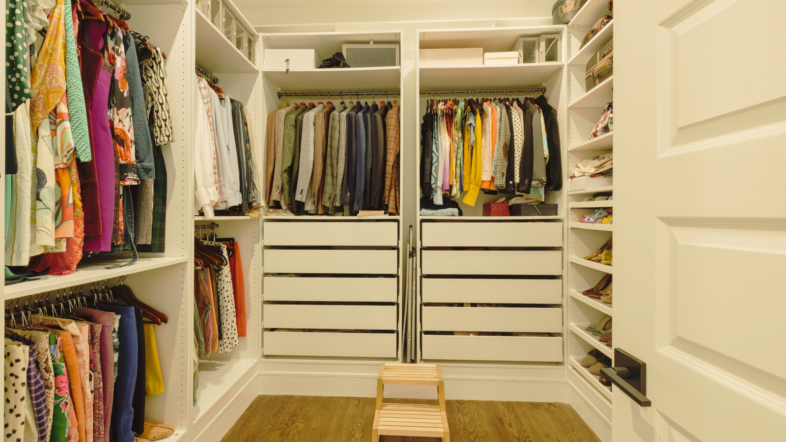 Modern walk-in closet with smart shelving and hanging space.